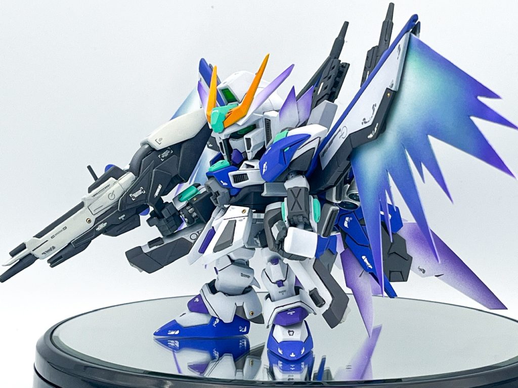 ▲強化兵装『ブリニクルユニット』を纏い、メタバース空間の寒冷地フィールドにあらわれる正体不明のシークレットエネミー。様々なガンダム作品のデータがフィードバックされており、ユニーク武装を満載した極悪難易度の隠しボス。……という設定。