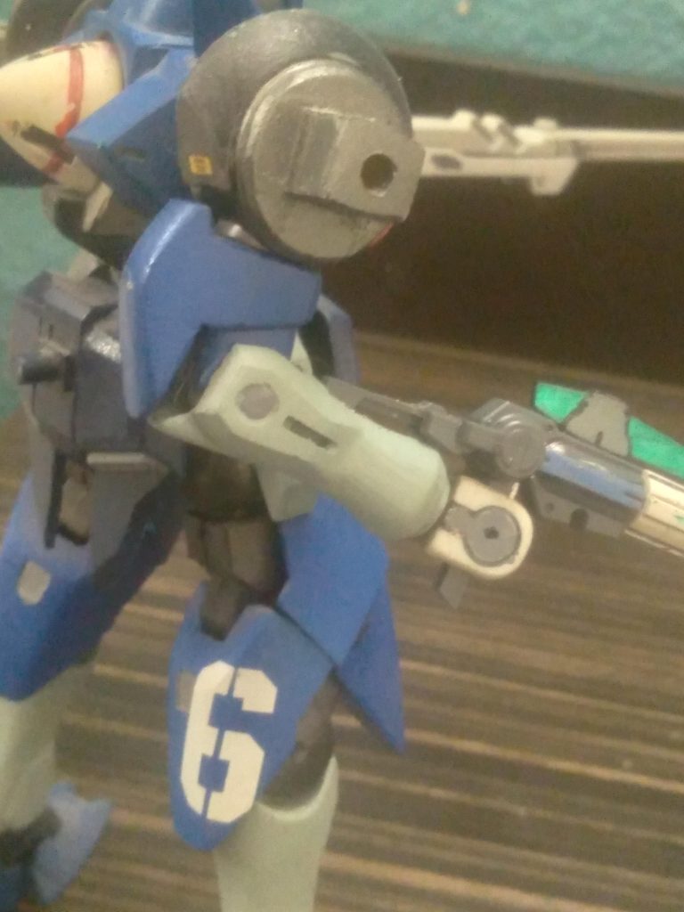 You can see I made the shoulder mount from plastic plates and a poly cap. Also, how the arm connector was sanded down to fit the rifle