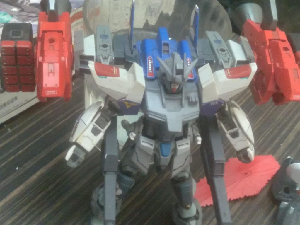 Hyper Build Booster- it is designed to give a boost in mobility. It's equipped with large boosters. It also has mounting points for different types of weaponry. Pictured are the twin high output beam cannons 