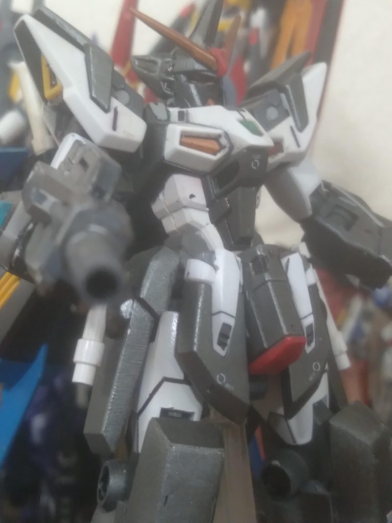 It has a dark color scheme because it is intended to be a villain machine. I combined parts from the livelance heaven, windam, strike freedom, freedom, and a couple of iron blooded orphans parts