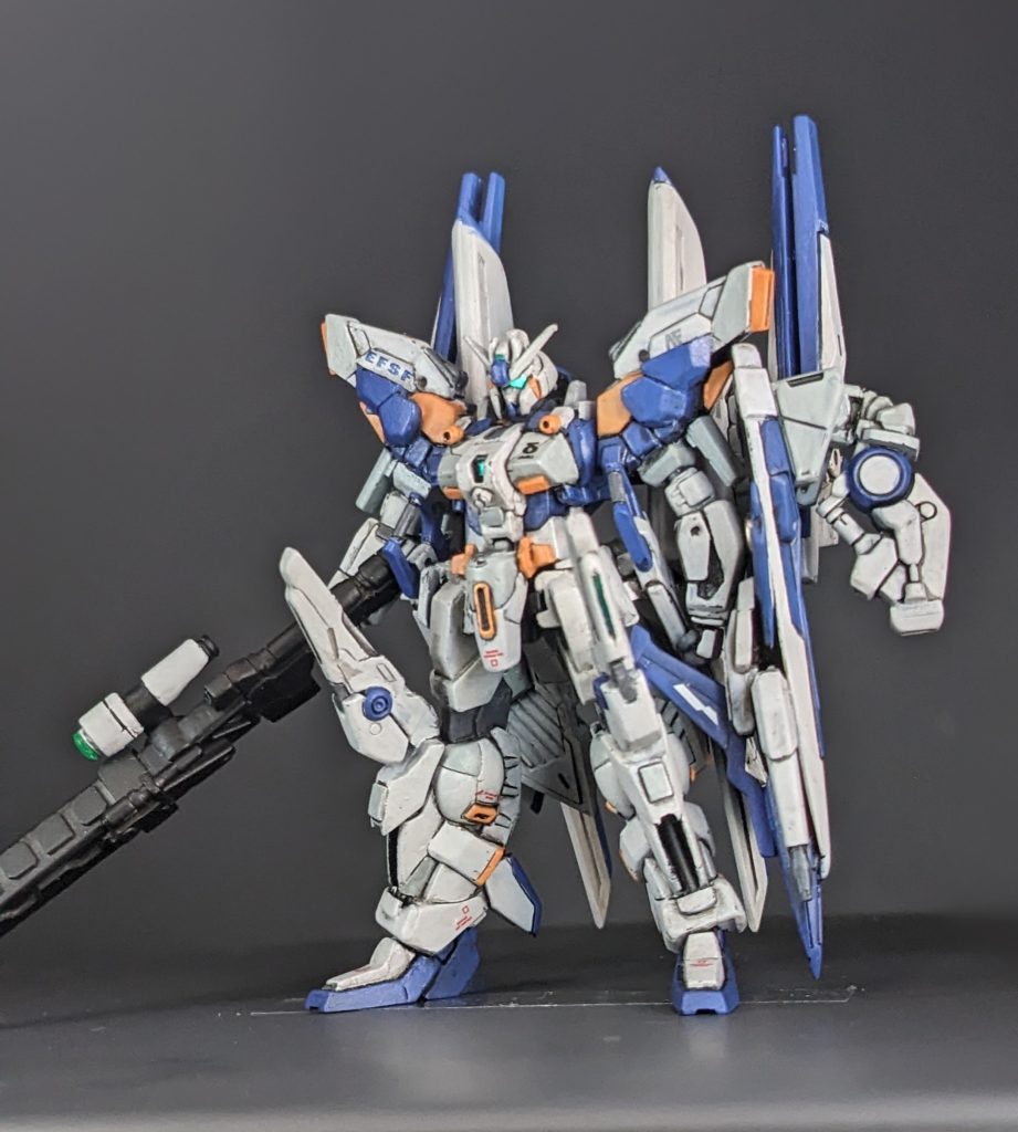 第1兵装フル装備形態。右腕に装備しているメガスマートライフルはビームスマートガンとロングメガバスターのデータを元に取り回しの良さと継戦能力を重視した性能になっている。シールドにはハイメガキャノンとビームサーベル、ビームガンが装備されておりベース機ではシールドに様々な装備が換装可能になっていたが、本機のシールドはハイメガキャノンが固定装備となっている。出力はZZの物と比べて60%ほどであるが連射が可能。ちなみにシールドとは名ばかりで防御能力は皆無に等しい。