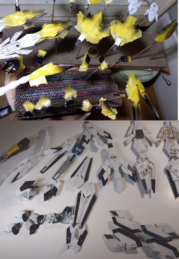 マスキングさんの塗分け部位ざっくり。塗装する前まで色決めてなかったんですが、ミキシングでペルフェクティビリティを目指したものの白一色は味気なかったので、今回はユニコーン1号機の白、2号機バンシィの黒青、3号機フェネクスの金色の3色でまとめる事にしました。フレーム以外はパリッとしたツートンカラーにしたかったので、機体の外周を覆うようにプリズムブルーブラックを光沢で塗り分け。