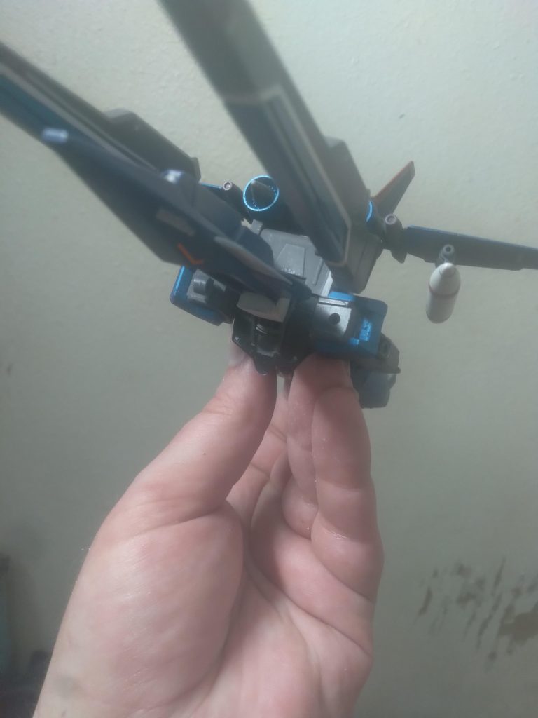 The jet Striker Pack pivots on the back of the Strike. The cannons are rotated forward so they can be fired in this mode