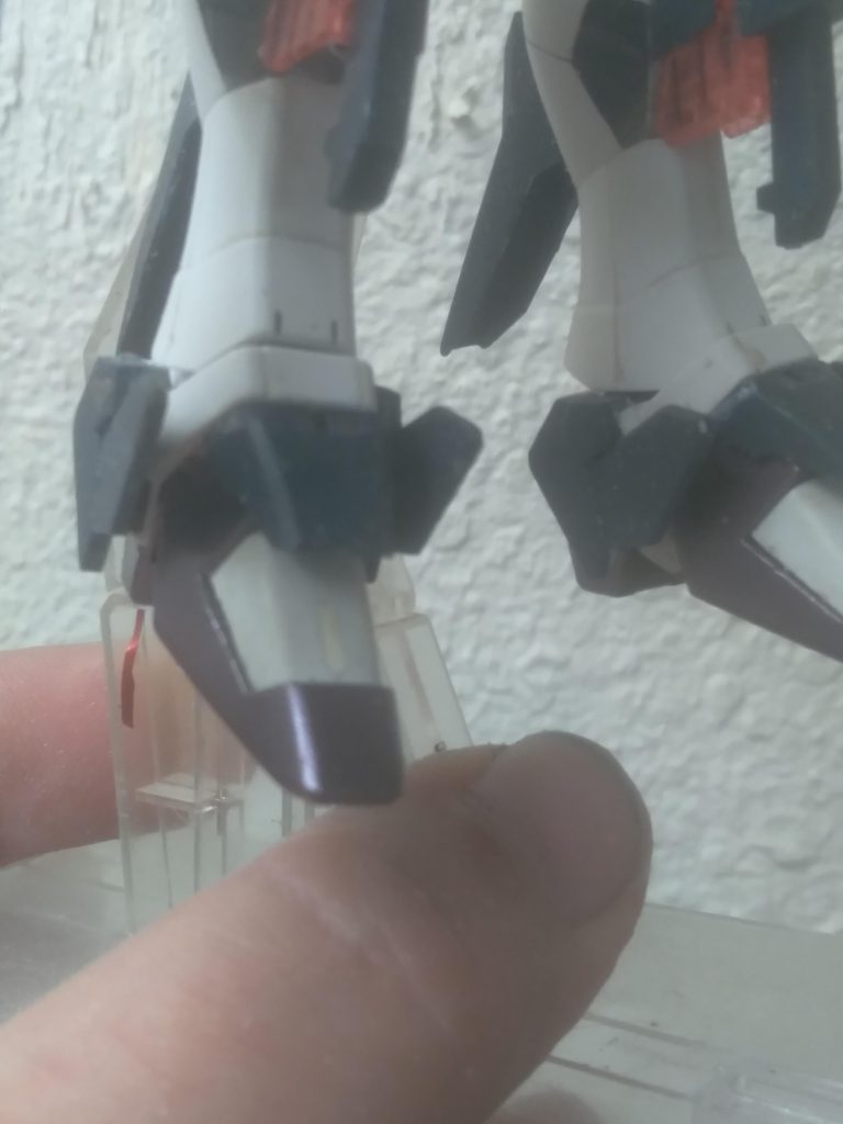 I took the parts off the Banshee and trimmed off the unwanted plastic and glued them onto the perfect strike freedom's ankle armor