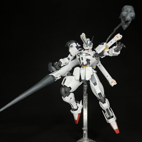 This is my take on converting the Gundam Calibarn to the Universal Century. I used parts from the Crossbone Gundam to modify the look of similar aircraft from that series. Major modifications:I reshaped the V-Fin to match the narrow shape of the Crossbone GundamI added the skull and crossbones to the headReplaced bit weapons with chain-guided INCOMs that are shaped like skullsExtended torso with 3mm plastic Modified weapon to have javelin end similar to the Crossbone Gundam X2My next step is to paint the aircraft. I am thinking of using a gray and blue color scheme similar to the Zeta Plus C1. （1枚目）