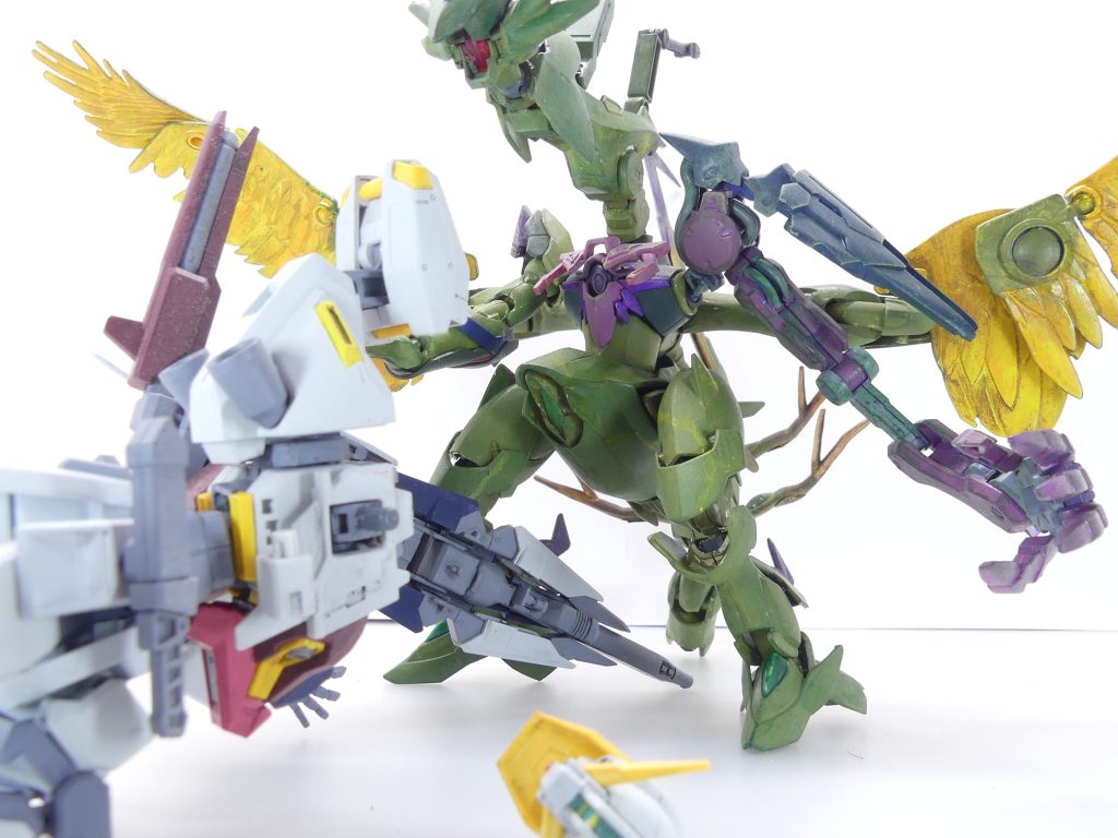 あたしのガンプラは、敵機体を撃墜できると知った。あの時、時空転移が起こった時、同一ディメンジョンにいたあたしと勇者パーティーだけが、あのモンスーツを倒せる手段を持つって事ね。あたしはマテウスで戦いは、したけど・・・駄目だった。だって、驚くでしょ?あのギラーガ・コカトリスが三度あたし達の行く手を阻んで来ちゃ。量産型だけどね。戦いはシュナイデの介入とさかな達の奮闘でなんとか勝利した、ものの・・・先が思いやられるわ。ゲーマスは、「メタ・キルゴア」と命名された当該ディメンジョンの制圧に、あたしと勇者パーティーの力が必要だって全GBNに発表しちゃったんだから・・・(第3改へ続く)(ここからはpixiv小説パートのネタばれを含みます、自己責任で)