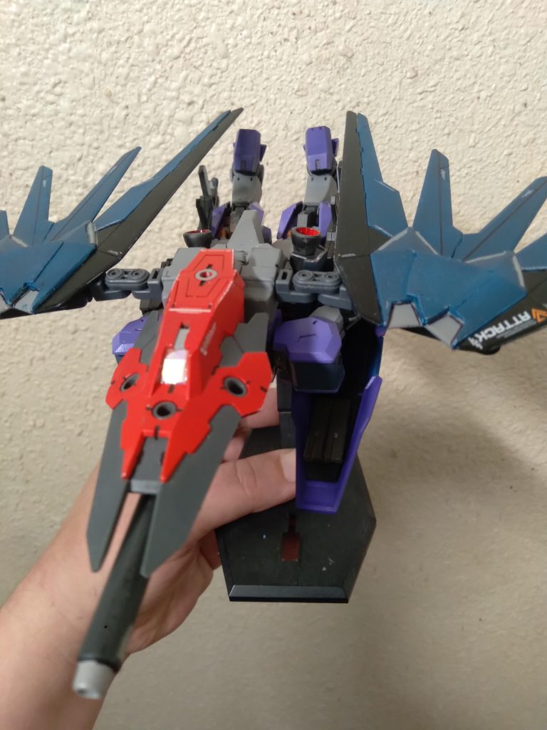 The backpack is custom made. It uses the hgce freedom backpack for the core. Each side is from the kotobukiya thruster set. I used gunpla battle arms parts to connect the wings