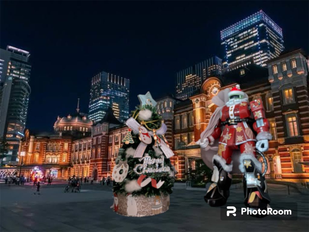 駅前の大広場には久々に巨大なクリスマスツリーが飾られていた。その横には赤いモビルスーツ。連邦政府の制裁によりエネルギー供給にも不備をきたしていた戦後ジオンには、イルミネーションに回せるほどの余剰電力がまだ無かった。しかしこの冬こそは何としても暗く沈みきった人々の心に明かりを灯したい。そう直に訴えて来た学生たちの相談に、マイはあるアイデアで応えることにした。終戦後武装解除された後放置されていたザクⅡ。そのイヨネスコ型核融合炉を電源として利用したのだ。ジオン美術大学の学生らによってサンタクロースに扮した姿に塗り替えられ、思い想いのデコレーションが巨体を飾る。かつて戦争の象徴でもあったMSが、クリスマスの光景に寄り添い、人々が憩うツリーに明かりを灯す。一種、異様な光景にも映るがそれが宇宙世紀0080年、一年戦争後のクリスマスだったのだ。その足元には、鎮魂の祈りを込めた無数のキャンドルが灯されていた。