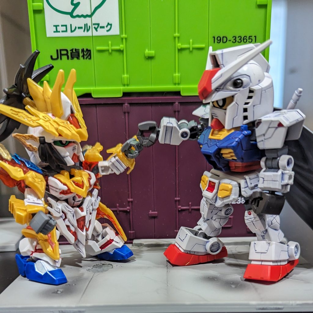 認め合い拳タッチ劉備「なかなかやるな、なんていうんだ。俺は劉備、劉備ユニコーンガンダム」F00「僕はF00、ヨコハマポートで生まれた」劉備「ヨコハマポート?聞いたことないな」