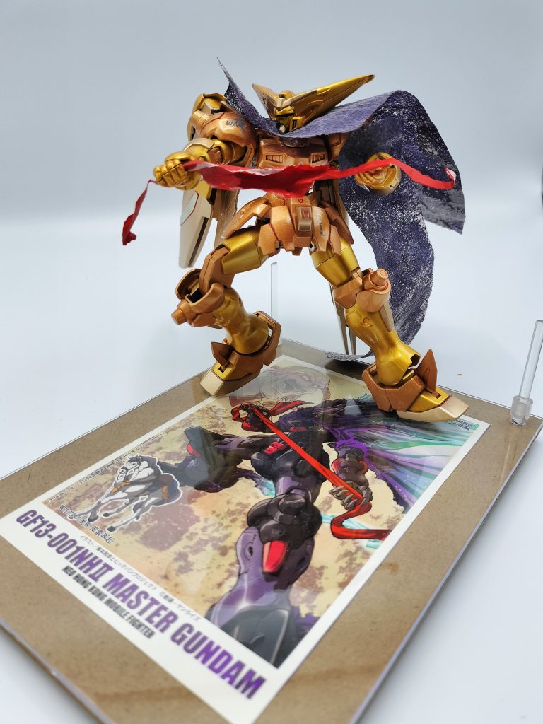 100均のフォトスタンドに、キット内あった島本和彦先生のイラスト入れてこの構図をやりたかった!Tamamaマントでマスタークロスとマント再現です。マント部はAmaz〇nの梱包紙でなく、今回はふるさと納税のホタテを包んでいた不織布っぽいものを使用しました。Tamamaマント マジ有能! Tamamaさんありがとうございます~(無許可)