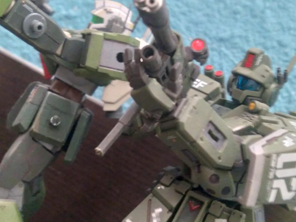 The shoulders feature mounting points for additional equipment