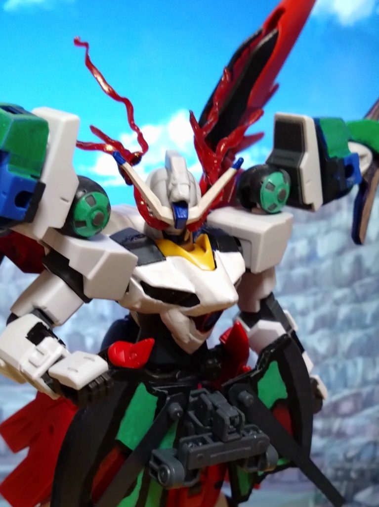 アルカの問いに、X(クロス)は答える。 「我が名はX(クロス)。この名、この姿こそが真実。ただそれだけだ」 リベロ、リベロドライヴユニットと背中のウイングからビームウイング展開。と、ここでトランザム発動。トランザムにヴォワチュール・リュミエール、更に阿頼耶識のリミッター解除。性能的にはリベロが圧倒的だと思われる戦況。 だが、アルカは冷静な分析により、リベロの弱点を見抜く。 「リベロは出撃する度、トラベラーズに帰艦する際には内側のフレームを修理・交換しなければならない…という問題を抱えたガンダム。そうだったな?そんな機体に複数の制限を解除、しかも阿頼耶識のリミッターも解除となると……」「さすがはギャザーロード隊の小隊長、様々なMSを搭乗した甲斐があるということか」 アルカの分析を分かりやすく説明すると、このアンラッシュモードはトランザムよりもごく短い時間でしか戦えない形態というデメリットがあるのだ。一回の戦闘で一回しか使えず、更に使用時間終了後には機体の負荷が大きくなることでそのまま戦闘継続が不可になってしまうという…まさに諸刃の剣。リベロは最強と思われたガンダムだが、実際は問題を抱えたガンダムなのである。 「アンラッシュモードによる戦闘は長くて1分。その間、小隊長には耐えられるだろうか?」「敵である俺にいろいろ教えてくれるなんて、余程の自信があるようだな?それとも、ただのバカか?」 X(クロス)とアルカ、互いのMSを見つめ合う。ここから本格的なバトルが始まる中、2人は思わずふと笑う。まるで、この戦いを望んでいたかのように…。 「X(クロス)、俺はもう既に答えを出していた。だが、お前という強敵に俺は戦いたいと思っている!」「フッ、私も同じ気持ちだ」 2人のガンダムが同時に動いた。決着をつけたい、ただそれだけの理由で2人の男達が互いの魂をぶつけ合う。それぞれのMSを使ってーーー   ーーーその後、2人の戦いは引き分けで終わった。 クロストラベラーとG:ユニバースの関係はまだ続くこととなり、X(クロス)はアルカに転生者であることをユノやサクラ以外に話さぬようお願いする。そんなX(クロス)とアルカだが、2人はいつの日か決着をつけたいと思っていた……。 『機動時空転移 ガンダムリベロ 第14話:新たなステージへ-後編-』  と、ストーリーはここまで。戦闘訓練の最中、リベロのパイロットであるX(クロス)が転生者だったというまさかの展開になりましたが、どんな人物なのかについては別の機会に…。 それはそうと、今回のストーリーでリベロの秘密が明かされました。リベロは最強…と思われた方がいると思われますが、リベロは自由を求めるガンダムというだけで、いろいろ問題があるガンダムなのです。ストーリーにもありましたが、リベロは一度出撃して戻った際には機体全体の装甲を外し、フレームを修理または交換が必要となるガンダムなのです。クロストラベラーにとって必要不可欠な機体なので修理費だけでも高額。つまり、欠陥がある高級MS…と言えるでしょう。また、このMSを上手く扱えるパイロットはX(クロス)以外いない…という設定でもあります。複数の武器、複数の形態、しかも複数のシステムを瞬時に扱う。ニュータイプやコーディネーターでも、慣れるのに相当な労力と時間が必要になるかもしれません。 パイロットのX(クロス)はそんな弱点を上手く扱って戦っている、そういう人物なのです。