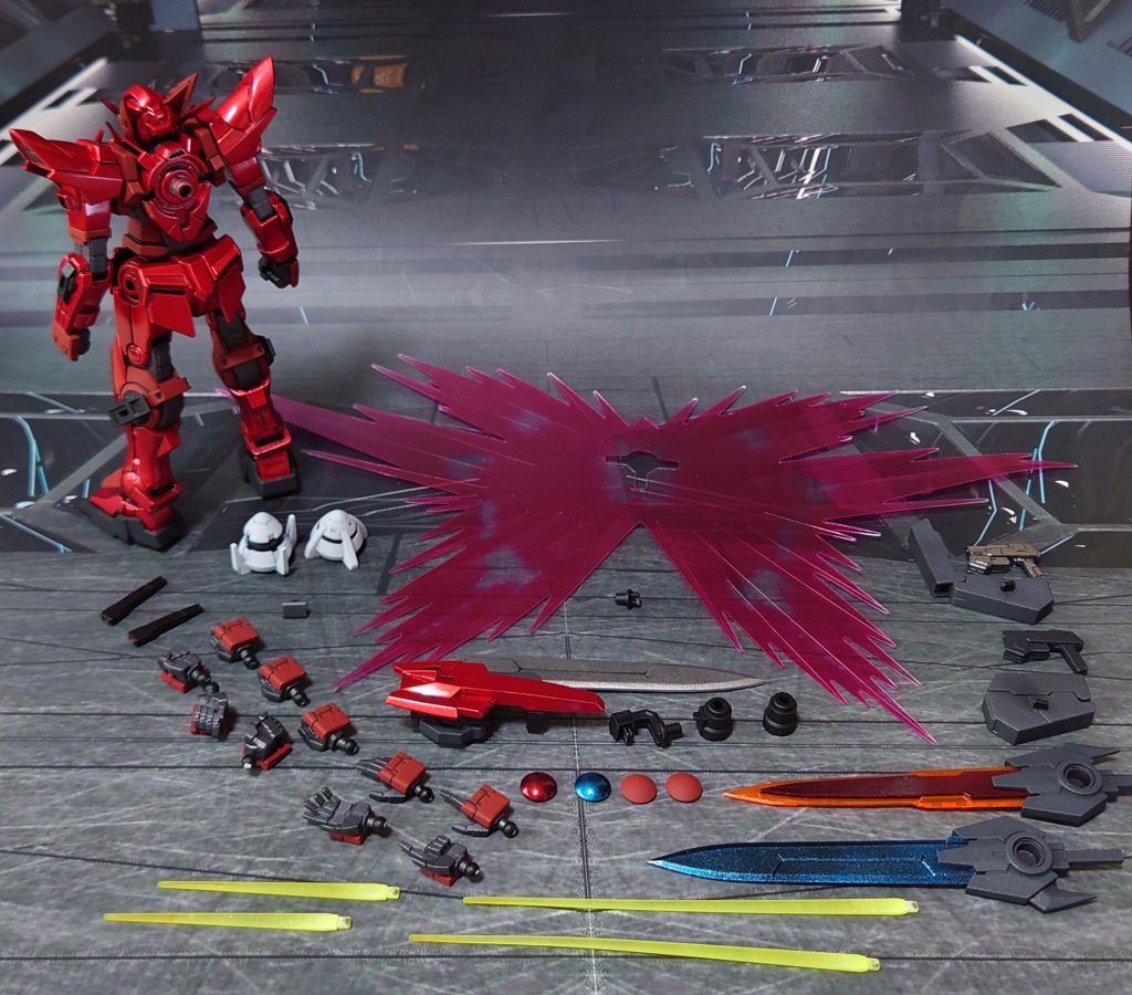 付属品一式。■塗装レシピ赤1：黒サフ→シルバーリーフ→メタリックレッド→光沢赤2：グレーサフ→ダルレッド→つや消し黒：黒サフ→メタリックブラック→つや消し銀：黒サフ→シャインシルバー→光沢白：黒サフ→シルバーリーフ→ベースホワイト関節類グレー：黒サフ→ガンメタル→つや消しポリキャップ：PPプライマー→ガンメタル→つや消しフェイス部白：グレーサフ→つや消しツインアイ：黒サフ→ガンダムマーカー・サイコフレームホログリーン→光沢胸部クリアパーツ：表側にメタリックオレンジ→光沢、裏側に市販のシール素材ハンドガンケースグレー：黒サフ→ブライトガンメタル→つや消しビームサーベル/ビームダガーグリップ：黒サフ武器類グレー：黒サフ→MSグレー連邦系→つや消しプロミネンスブレイド赤：黒サフ→シャインシルバー→クリアレッド→光沢プロミネンスブレイド刃：蛍光オレンジブライニクルブレイド青：黒サフ→シャインシルバー→クリアブルー→光沢プロミネンスブレイド/ブライニクルブレイド宝玉：市販パーツに光沢→裏側に市販のシール素材GNソードType-D刃：黒サフ→ブラック→メタルシルバー→光沢ビームサーベル刃：根元にベースホワイト→先端側にクリアイエロー→全体に蛍光イエローセンサー類：市販のシール素材を併用墨入れ・部分塗装：ガンダムマーカー各種