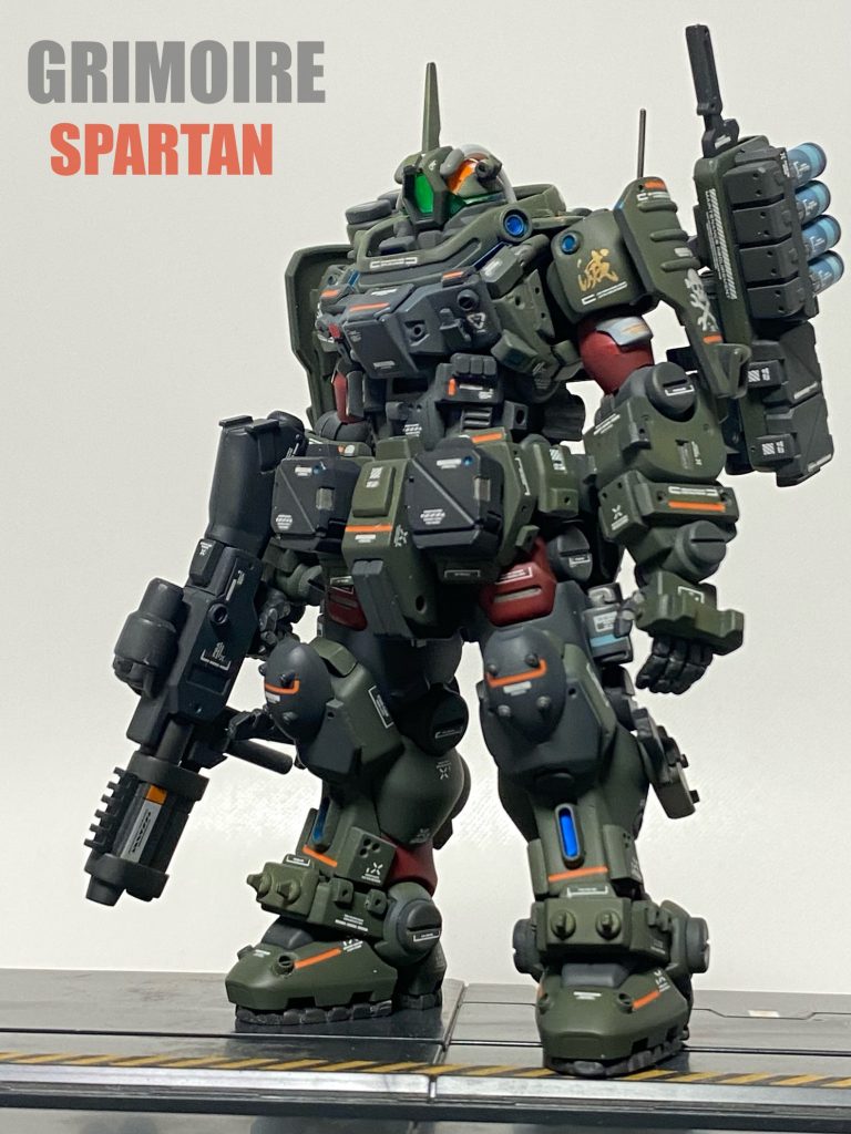 ガンプラメタバース内での保全活動を行う管理者のメンテナンス部門「コンバット・デバッガーズ」所属のガンプラ。メタバース内に発生するELダイバーとは別の存在、悪意を持って破壊の為に発生する「バグ」を実力行使で処理するデバッグ用の機体。