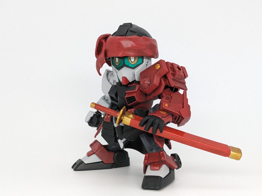 鞘付きの刀。刀の鞘は光沢にして朱塗りのイメージに。