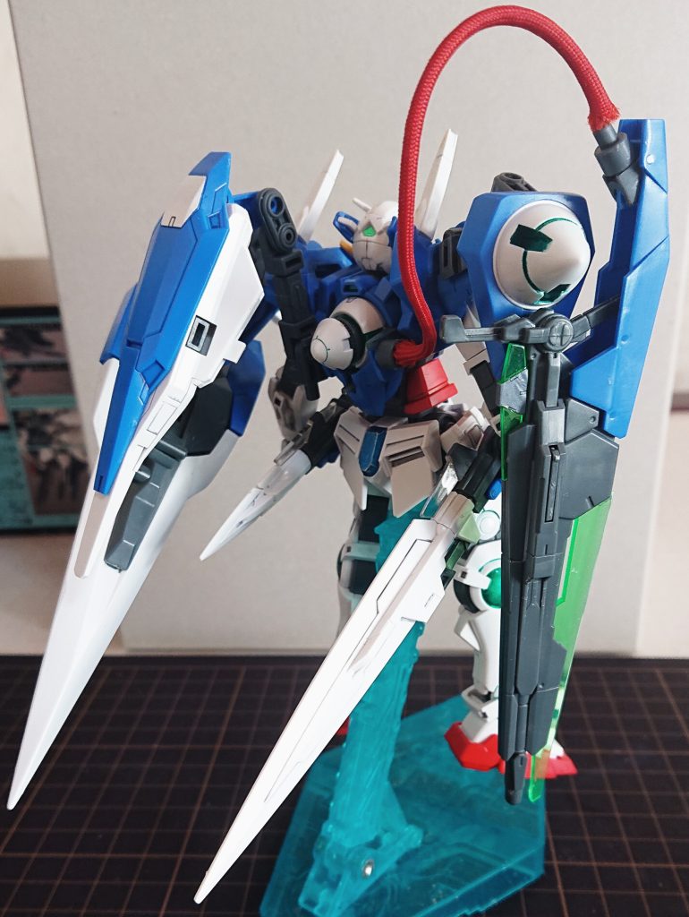 そこで強化プランとしてGNソードⅡブラスターをメインに射撃火力を強化することになった。しかし、コネクタの調整ができず粒子供給量に問題があり火力が思うように上がらなかった。そこでGNドライヴから直接パイプでGNソードⅡブラスターに直接粒子供給することで問題解決を図った。武装は固定装備のGNビームサーベル兼GNビームダガー、GNバルカン追加装備はGNソードⅡブラスター、GNソードⅡロング、GNソードⅡショート、GNバスターシールド、シールド内蔵GNビームガン。