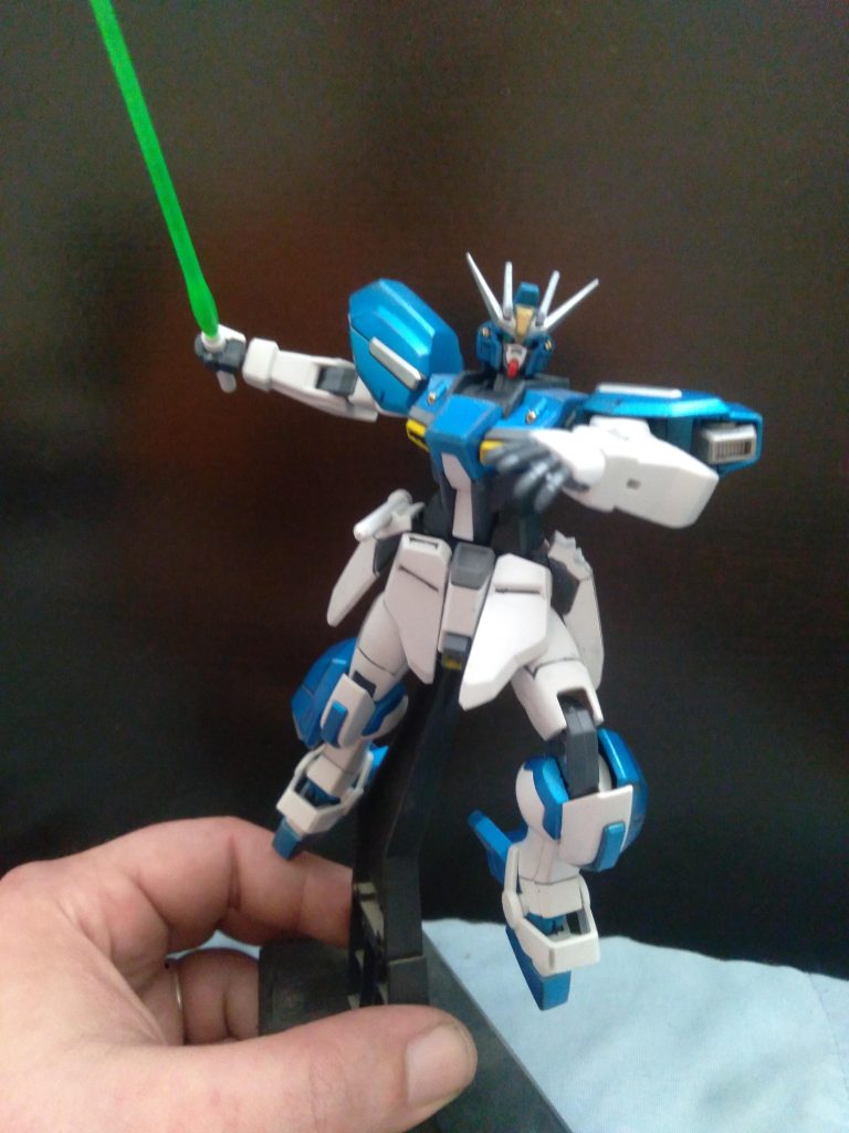 The standard load out is made up of a new high energy beam rifle, two beam sabers, a shield with two homing rockets on the underside, and a 180MM rocket bazooka that is capable of firing multiple types of rounds 標準装備品は、新型高エネルギー・ビーム・ライフル、ビーム・サーベル2本、下面にホーミング・ロケット弾2発を備えたシールド、複数種類の弾丸を発射可能な180MMロケット・バズーカで構成されている。