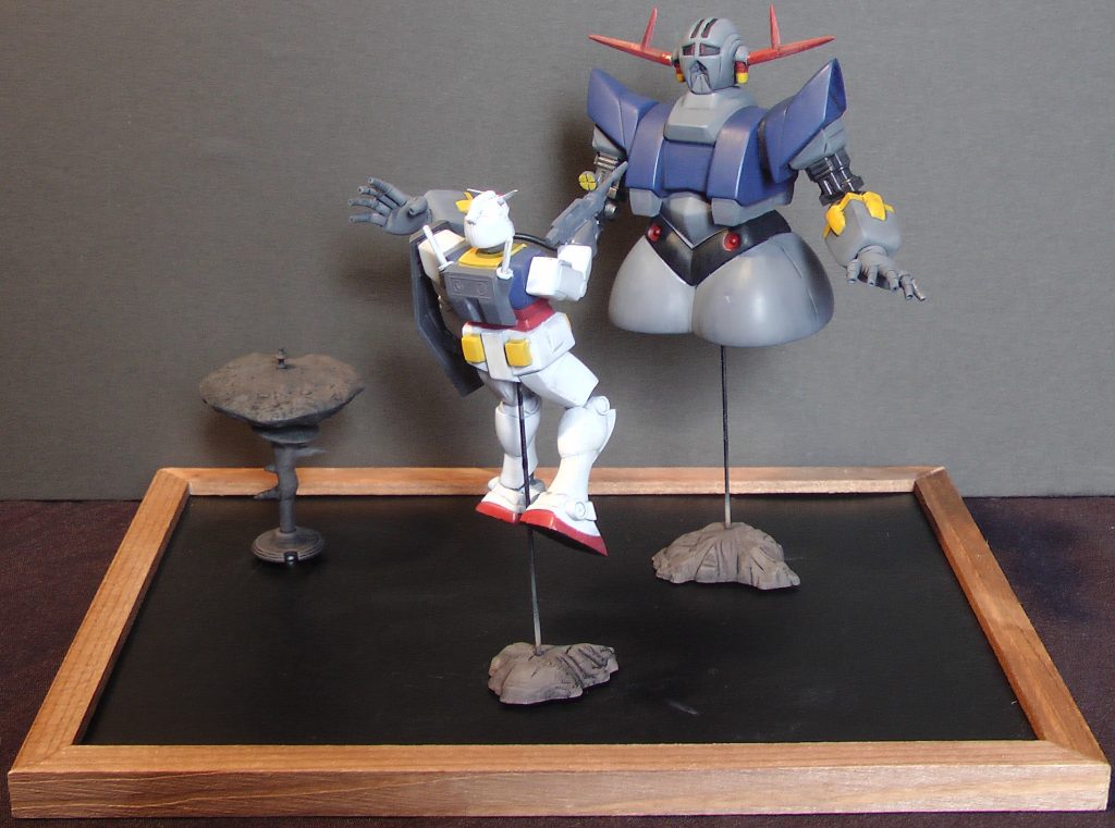 ベースはマグネットボードで、モビルスーツを支える支柱及び岩はガンダム情景模型付属品、ア・バオア・クーは「2分でつくるガンダム名鑑ガム」おまけです。いずれもネオジム磁石で動かせます。