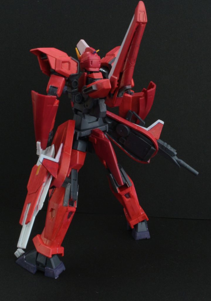 本機はイージスをモチーフに制作。同じくX303フレームを採用し、原型機と比べ、ストライクノワールと同じく、パワーエクステンダーや戦闘支援AIの採用やヴァイアブルフェイズシフト装甲を採用し、機体のエネルギー消費の効率化や操作性向上を果たしている。