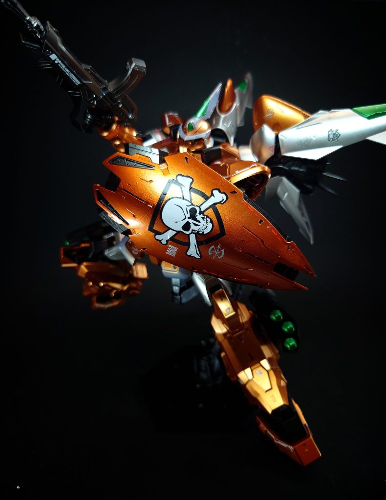 シールドミゲルのパーソナルマークである骸骨と盾が描かれた実体盾。PS2用ソフト「機動戦士ガンダムSEED 終わらない明日へ」ミッションモードのオープニング映像で装備している。なお、シールドの形状はダギ・イルスの流用となっている[3]。