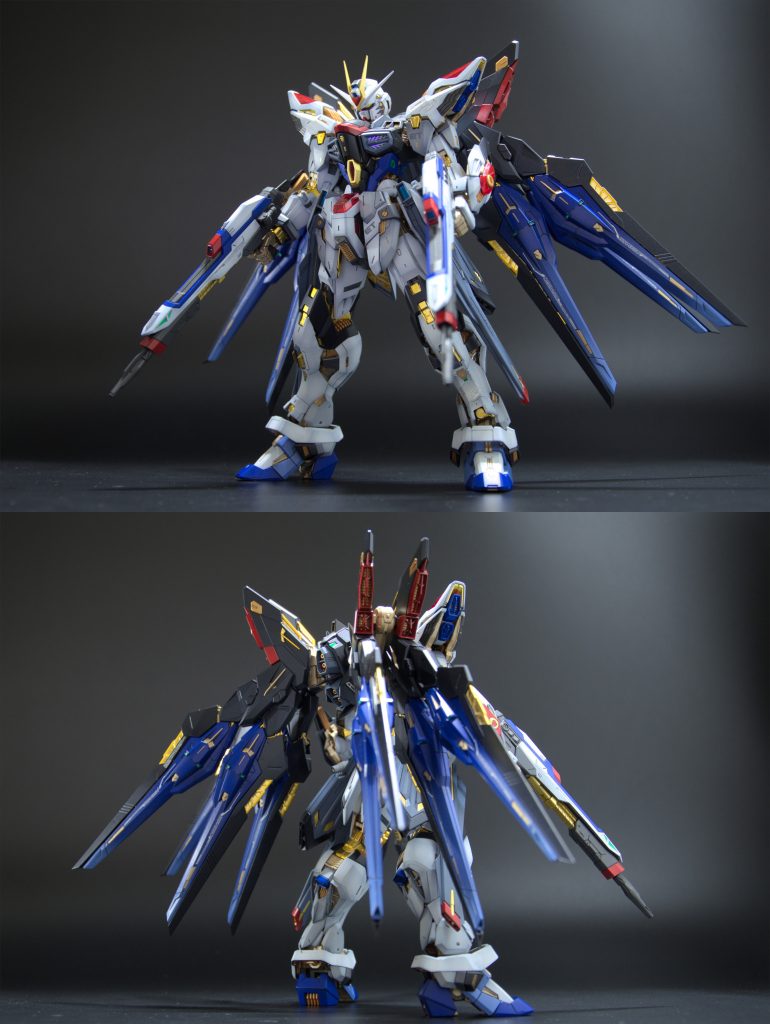 本体がパーツみっちりで重みがあるので、ごついバックパックを背負ってても自立できちゃうすごい。ちょっと固いくらいの関節がいい感じに姿勢を保持してくれるので、意外とポージングが楽でした。ディティール、プロポーション共に十分すぎるくらいかっこいいので塗装のみ実施。セールスポイントである内部フレームはゴールドの成型色だけ塗装。使ったのはガイアノーツのサーフェイサーエヴォゴールド。サフだけど落ち着いたゴールド色だったので採用しました。あとは部分的に配色を増やしたのと、羽をグラデーションっぽくしたのがオリジナルポイントです。シールドは蛍光クリア、ビームサーベルは蛍光ピンクで塗装したのでブラックライトで光ります。