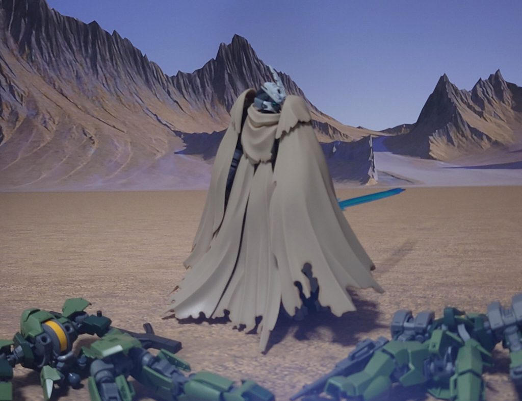 ギャラルホルンの部隊を壊滅させた、マント姿のMS。その手には、“青い炎を噴き出す武器”が握られていた。