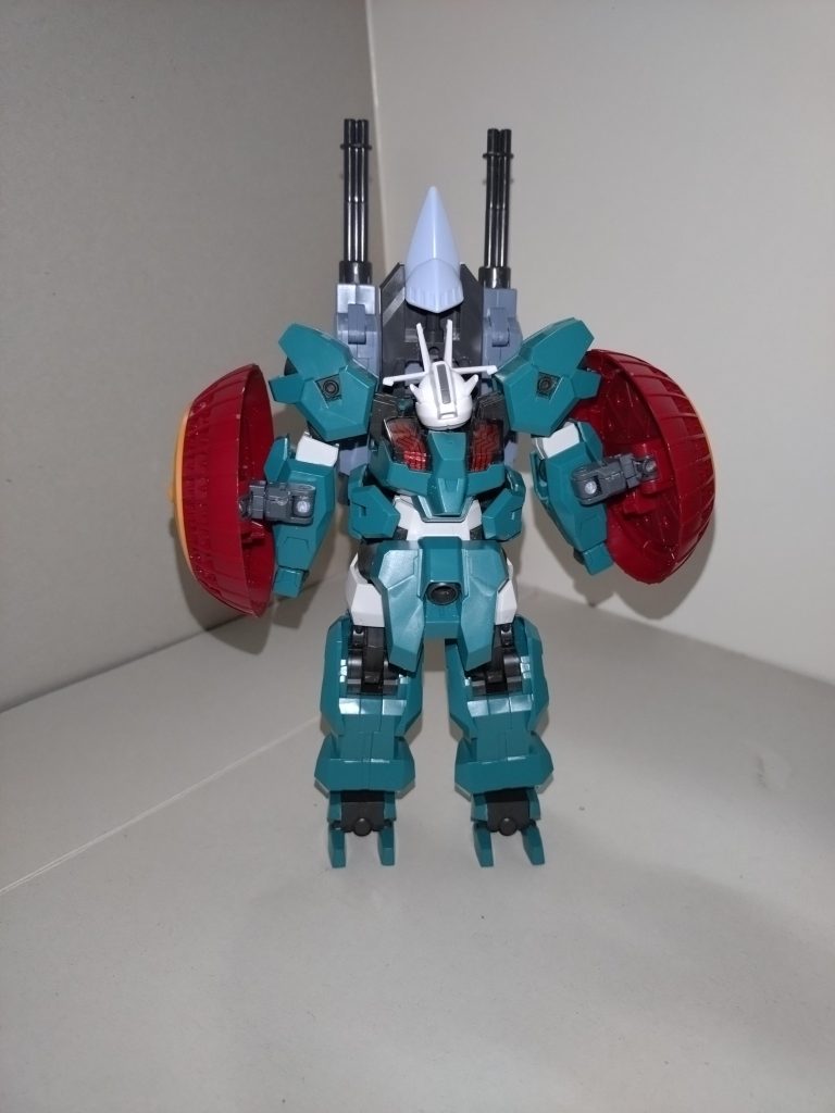 MA形態ヴェールと同じく、MA形態への可変機構を持つ。変形時、頭部と下半身の180°回転、肩部アーマー跳ね上げ、腰部スラスターの180°回転は変わらないものの、MA形態時の機首がギャンバルカン風に変わり、かつ両脚の90°回転がさらに付加され、変形時にはガニ股になる。これにより、拳が隠れるようになった。頭部前方のアンテナ中央部をMA時の機首がホールドする。