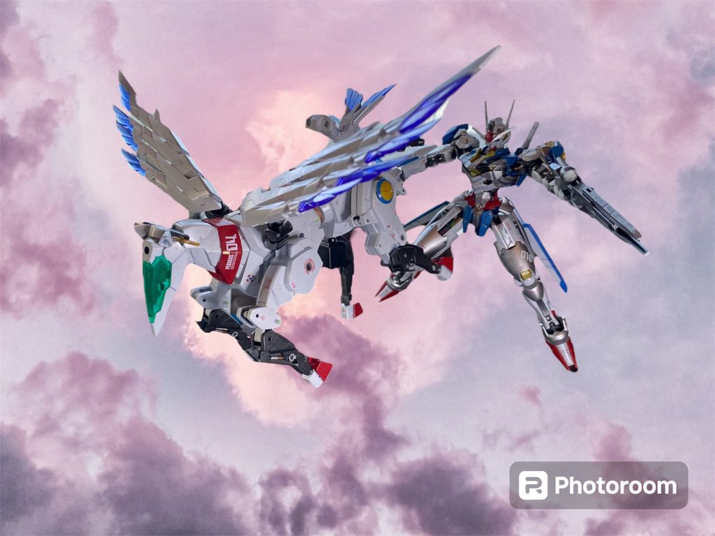 対するネオ・トキオ代表のガンプラファイター、ナツミ・ホーンフィールドはキングオブハートの称号を持つアーシアン格闘技のチャンピオン。超近接格闘戦を得意とし、愛機であるデミ・フルバーディングにはゼロ距離まで瞬時に間合いを詰められる走破性と、最大の武器である拳を使った攻撃を強化するカスタマイズが施されている。アナウンサー「かつて、東洋一、いや世界随一の大都市と呼ばれたトウキョウも、急速に進んだ砂漠化の波に飲み込まれ、今や“東京砂漠”と呼ばれる無人地帯が広がっています。宇宙に上がったネオ・ジャパンから独立した人々は、対照的にネオ・トキオと呼ばれる地下都市を形成し、“地底の民と”して営みを繋いできたのです。さて、まずこの荒野に舞い降りたのはネオ・ウェールズ代表、ペガサスナイト・エアリアル!白き空の騎士が今回も勝利の栄誉を手にするのか⁈ おぉ〜っと、砂嵐の中から現れたのは既に伏兵していたネオ・トキオ代表、デミ・フルバーディング!砂塵に紛れつつ急激に距離をつめて、一気に自身の間合いに持ち込むつもりのようです!」