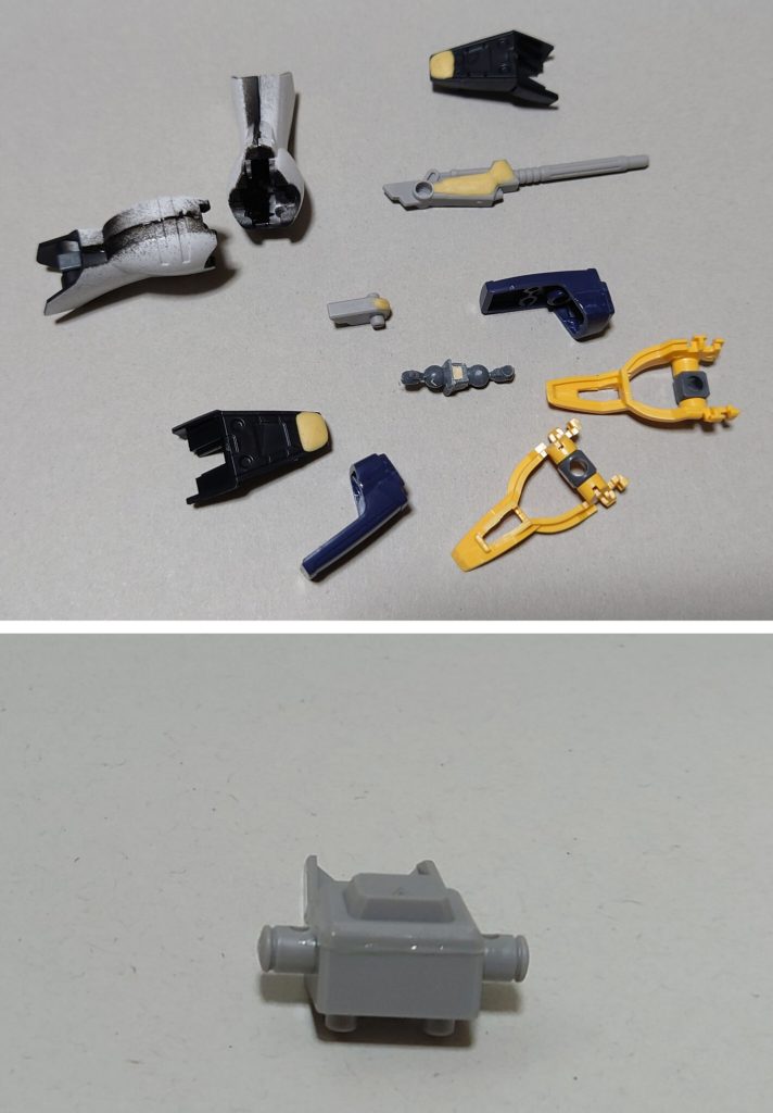 肉抜き穴埋めと合わせ目消しの様子。合わせ目消しは肩エングレービング部、前腕袖、脛前後、バックパックに実施。肉抜き穴埋めは首関節ポリキャップ、足爪先、ビームサイズのビーム発振部裏側、ビームサイズ収納形態の裏側に実施。