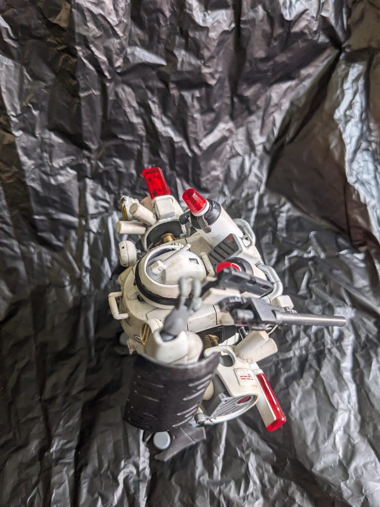 この機構は火器の露出による破損や遺失などを問題視されたが、もともと後付けでありやっつけ仕事の感は否めない。そもそもこの火器にしてもドラッケンEのマニュピレーターが三本指だったため、威力を落としたものしか使えないというありさまだった。これらの問題からスペック不足は否めず、早急に正式なMSの配備が求められたのは言うまでもない。