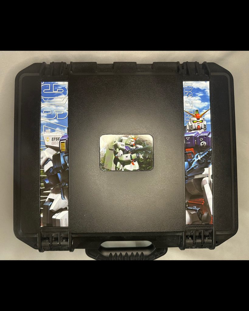 I cut out pieces of the box art and glued it into the recessed areas of the plastic case. I then added a clear coat covering to protect the art and cardboard over time.