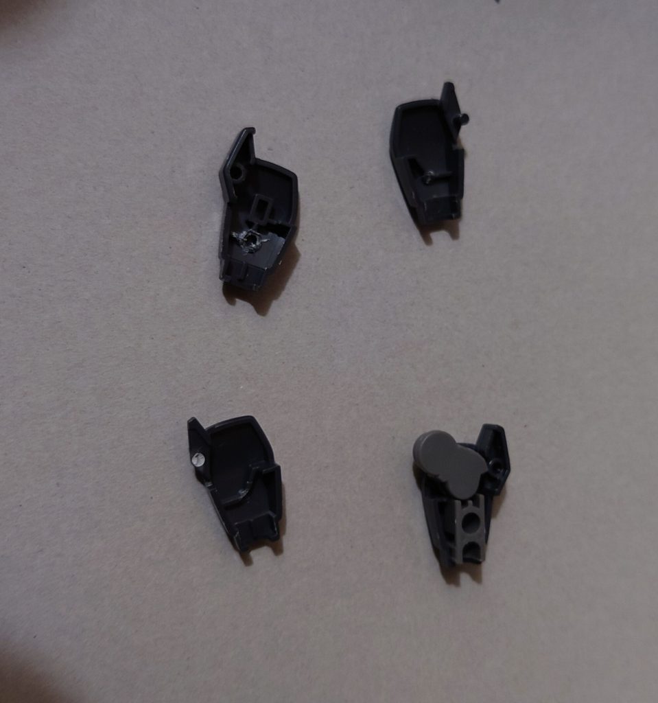 前腕合わせ目消しのための、後ハメ加工。他の合わせ目消しと肉抜き穴埋めは写真を撮り忘れましたが、合わせ目消しは頭部、肩アーマー、前腕、脛前後に実施。肉抜き穴埋めは首関節ポリキャップ、足首関節、足爪先、シールドクロー裏に実施しました。