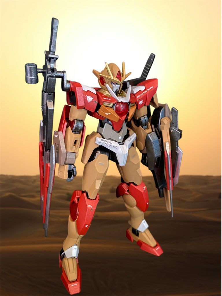 沈黙したかに見えたコマンドクアンタのフレームからあまりにも眩しすぎる光の粒が溢れ出したかと思うと、それは無骨な鎧を脱ぎ捨てるかのように装甲をパージした。 プロトダブルオークアンタ ーーーそれはダブルオーガンダムの意思を継ぐべく設計されたクアンタのテストのため建造されていた試作機であった。オリジナルの二基のGNドライブはイノベイターとの最終決戦で損失した為、それに替わる新型太陽炉を現在木星圏にて建造中であり、本機はそのツインドライブ直結機構開発のため擬似太陽炉二基を搭載し砂漠基地で密かに試験を繰り返していたのである。機体は点検用を意味するインスペクションカラーに染められ、また砂漠に紛れるようなサンドカラーも採用されている。コマンドクアンタの外装は、それを保護・秘匿するための擬装であり、仮の姿であった。