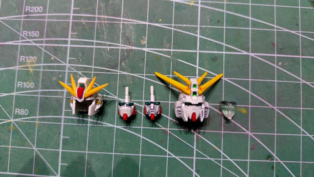 改造部分の補足Xでゴッドガンダムのフェイスを使っていた方がいたので、手持ちのゴッドガンダムの顔部分をレジン複製して塗装しました。ジャンクのポリパーツを加工して、首の受けを入れてはめ込んでいます。うまいことかっちりできたので満足です。最後までお読みいただきありがとうございました。