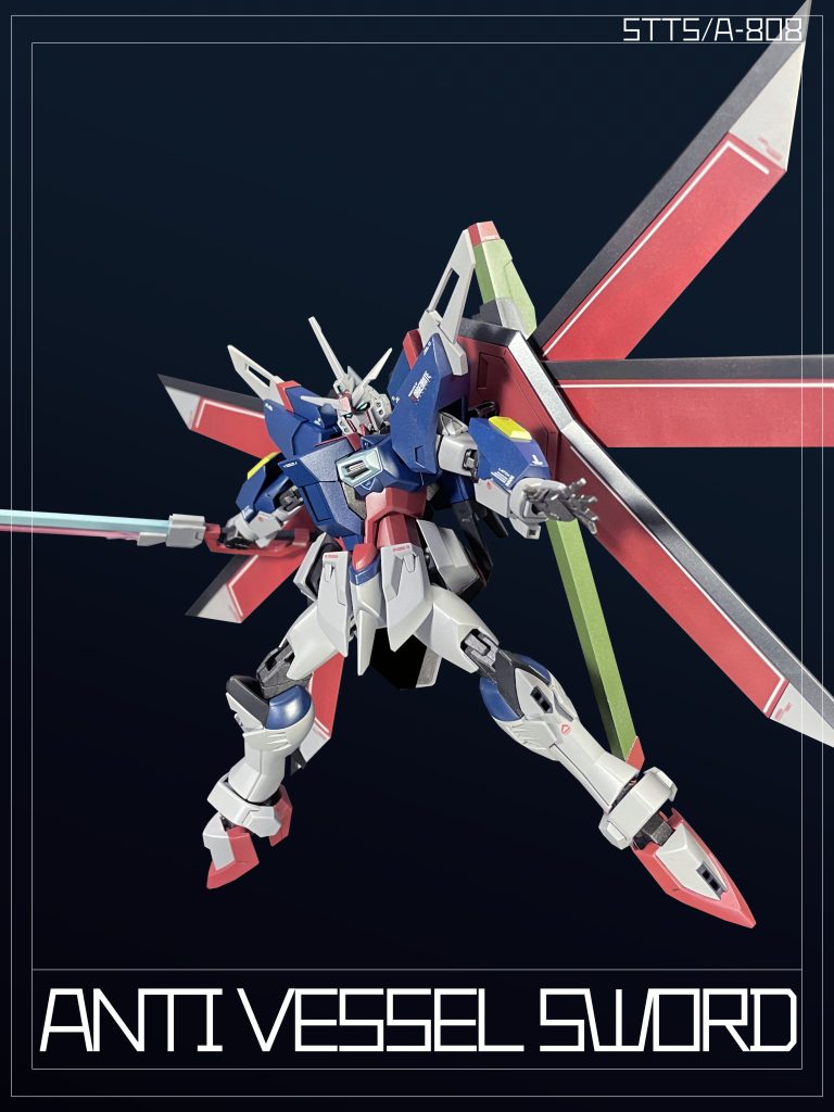 ビーム刃を備えた大型対艦刀。高い威力を発揮するが、機体の均衡を欠如する大型武装であり、高い操縦技能が要求される。この武装は「EW454F」の大型対艦刀と同系列の武装であるとされる。Large Anti Vessel Sword with beam blade. Although highly powerful, it is a large armament that lacks the equilibrium of the MS and requires high maneuvering skills. This armament is said to be in the same family as the “EW454F” large Anti Vessel Sword.