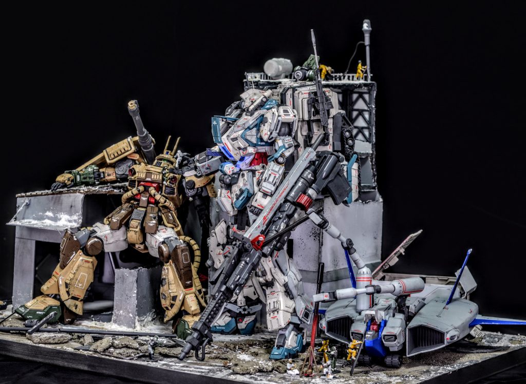 舞台は宇宙世紀１００年、ジオン共和国自治権返還に反発して蜂起したジオン残党と、迎撃にあたった連邦軍の陸戦部隊との間で起こった市街戦の直後の情景です