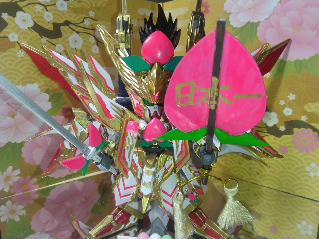 桃の太刀と軍配、各所に桃の飾りをつけました