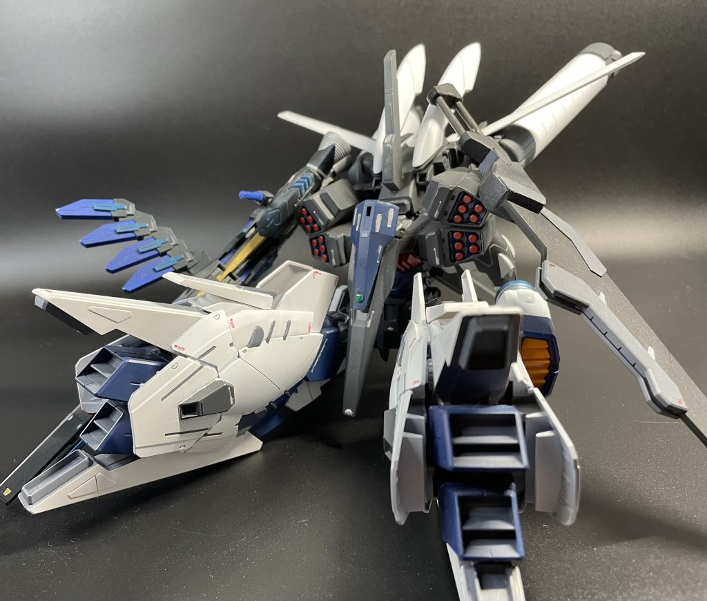 Hzw-ALLファイナルフェイズアカバネの協力の元制作されたMAガンプラ。三つのHWを同時に使うという無茶を成すために、本体(バルバトス)と装備(ファイナルフェイズ)に分け、GBNの絶対ルールである100のポイントバランスを実質200まで引き上げることに成功させた。その分、装備側を操縦するダイバーは自衛力すらない機体で戦闘中域を彷徨うことになる。