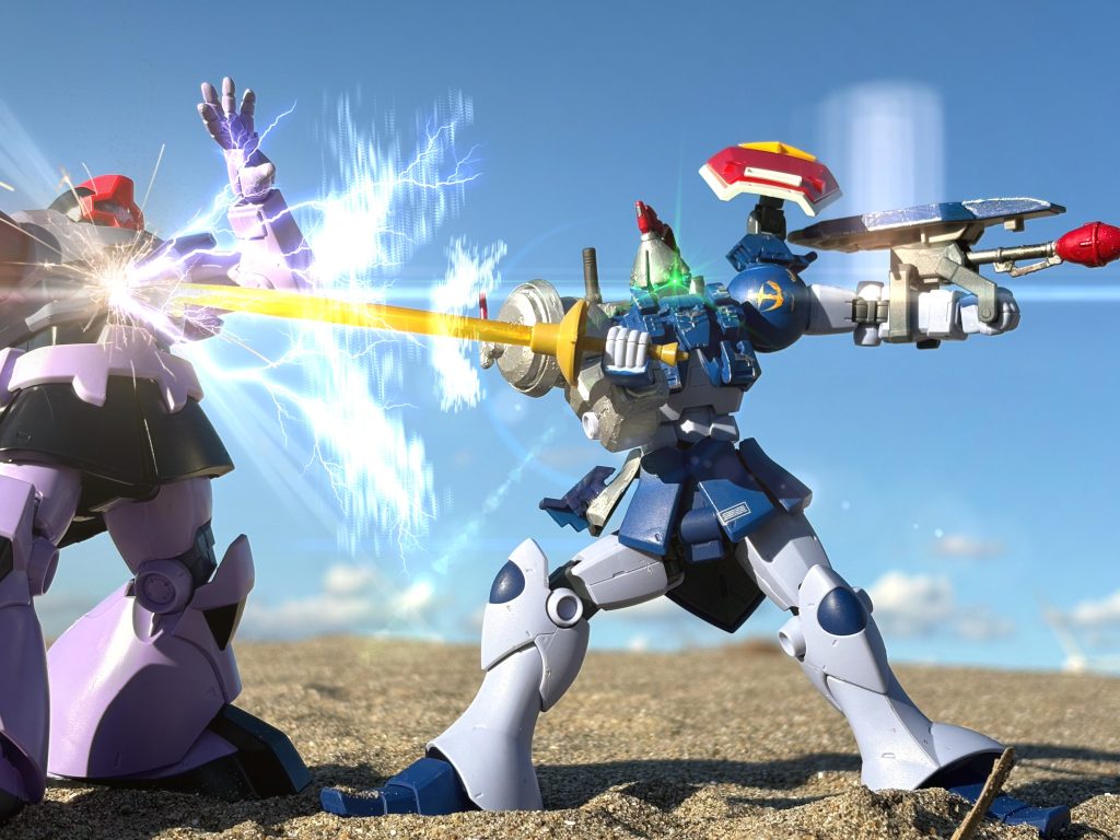 既に他の僚機も前進し各所でMS戦が展開されているのは確認した。これなら敵の取り巻き達から集中砲火を浴びる事は無いはず。第一次世界大戦の歩兵さながら、MSサイズの塹壕にも見える窪みから飛び出したドムはそのままジャイアントバズを敵の足元に向け連射後、放棄。ヒートサーベルを抜き突進した。しかし、敵機はそれ以前のMSでは考えられない程軽快なステップを繰り出し爆炎から逃れる。手には先程のライフルでは無く外見だけで連邦のMSの持つ物よりも高出力と分かるビームサーベルが握られていた。突進する方向を転換する為に一旦立ち止まってしまうドム。だがその一瞬を敵機は見逃さず、フェンシングの様な挙動でコックピット目掛けてサーベルを突き出した。ビーム刃は容易く装甲を裂き、その先にいるパイロットを蒸発させる。ドムパイロットの命を似ってしてこの決闘の勝敗は決したのだった。