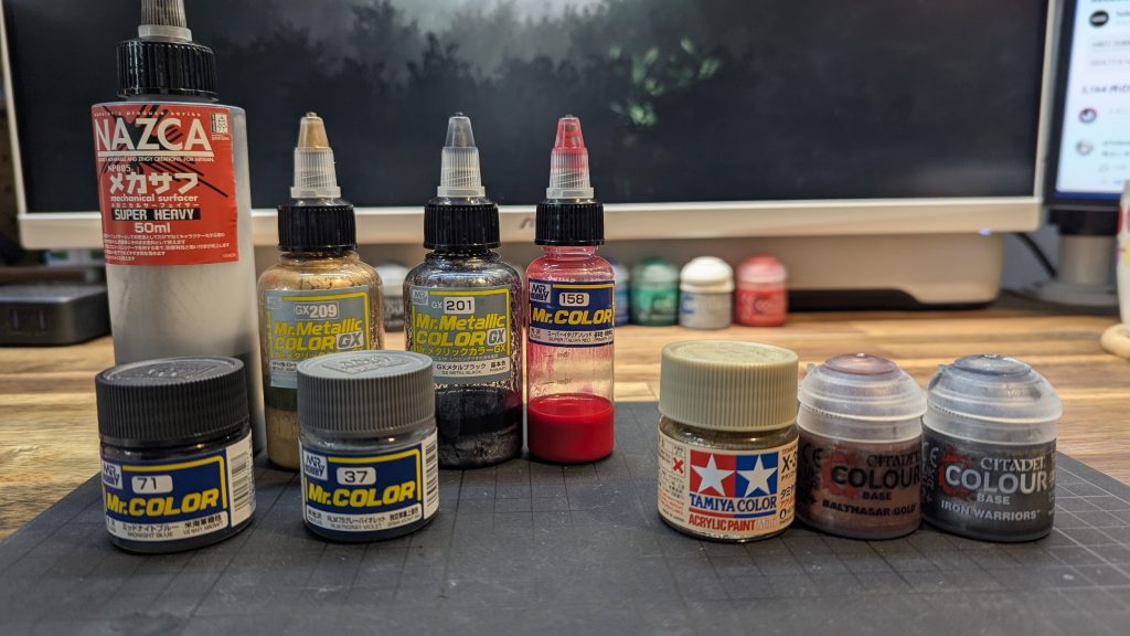 塗装レシピは以下のとおりです。下地：ガイア　メカサフ　スーパーヘビーフレーム：クレオス　GXメタルブラックボディ灰：クレオス　グレーヴァイオレットボディ黒：クレオス　ミッドナイトグレー＋イタリアンレッド極少量アクセント①赤：クレオス　スーパーイタリアンレッドアクセント②金：クレオス　GXレッドゴールドアクセント③銅：水性　シタデル　バルタザールゴールドアクセント④銀：水性　シタデル　アイアンウォーリアトップコート：ガイア　EX04フラットクリアー写真のタミヤ　チタンゴールドも極少ない部分に使用しました。元々のプロヴィデンスの配色を損なわないように、豪華絢爛な和柄（黒・金・赤）を意識しました。シタデルカラーを初めて使いました。塗り心地や発色がとても気に入りましたのでうまく使いこなしていきたいですね。