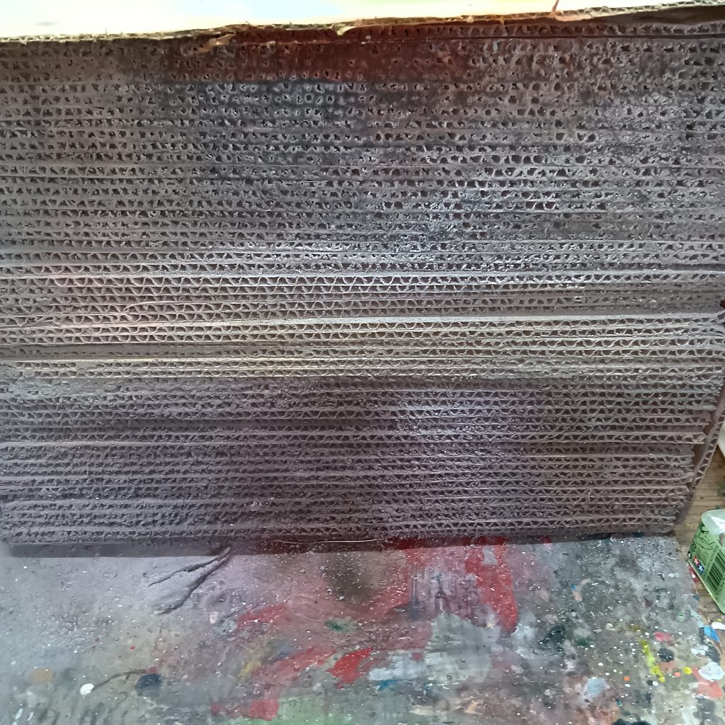 コテコテに塗料が付いた塗料ブースのフィルター。