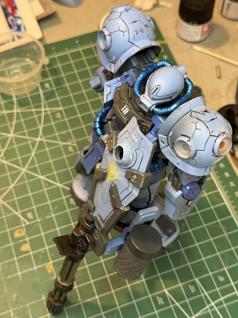 This photo shows the blue paint shading.  The light for the photo is directly above the figure yet the areas to the right in the photo are lighter.