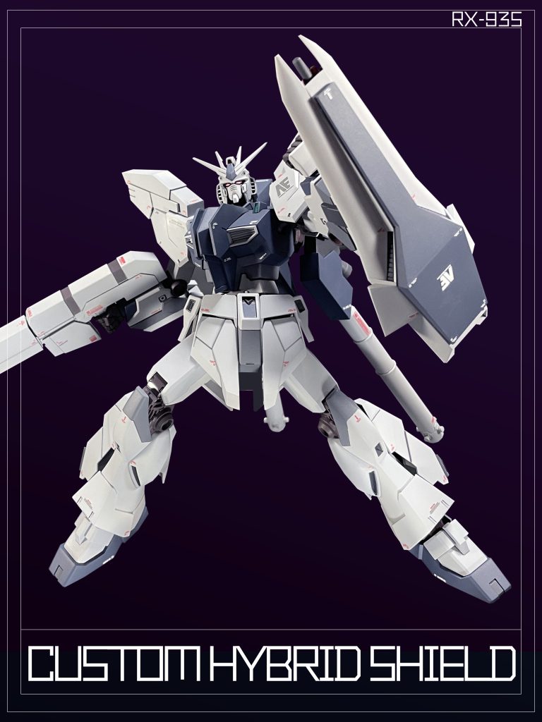 「RX・M-Sh-WR/U035 ハイブリット・シールド」は耐弾性向上のために増加装甲を装備。この増加装甲は「ルナ・チタニウムX」を含んだ、3重ハニカム構造の防弾板へ5層構造のビーム・コーティングを施したものである。裏面に「ビーム・キャノン」1門と「誘導ミサイル」4発を搭載する。Hybrid Shield” is a modified version of ”RX-M-Sh-WR/U035.It carries one “beam cannon” and four “guided missiles” on its back side.The surface is equipped with increased armor made of Lunar Titanium X with five layers of anti-beam coating, improving its defensive