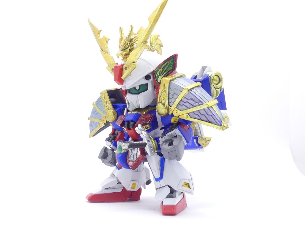 【ガンプラデータ】配役:武者駆路守精多頑駄無演者:カスガ・コウシロウ所属:昇陽高校ガンプラ部GP(ガンプラパワー):335使用ガンプラ:SDCS Zガンダム BB戦士武者列伝 疾風剣豪精太 BB戦士武者○伝3 蒼天丸&紅天丸レギュレーション:オフィシャルレギュレーション機体解説:カスガ・コウシロウがマサミチの元祖SD精多にインスピレーションを受け、彼の指導でビルドしたガンプラ。基本的には堅実なミキシング構造をしているが、さらに一手加えたあたりは「エバーランド」で戦うのにふさわしい方向性になっている。ちなみにガングリモワールよりも少しだけGPが上なのが自慢。あとバルカンはいつでも使えるように見せた。 ようやく、ようやく…ナイトリージョン編全13回分のプロットがまとまったぞ筆者です。要するに次Chapter分まで。こう書いていると言うことは…次Chapter分までの登場機体やその能力・改造方針が決定したことにもなります。きちんと機体の登場順とか決めないとなかなか進めなかったからね…今回は同ネタ多数感のある(というかこの前一度見た)SDCSZと疾風剣豪のミキシング。ともに昨年再販だったこともありやりやすい部類ではありますが…そこは「放課後」なので、今回使用の疾風剣豪は再販ではなく中古赤バンダイで連載開始前に確保したもの。要はSDCSZが偶然手に入っちゃっただけで当初は別プランだったと言うこと。