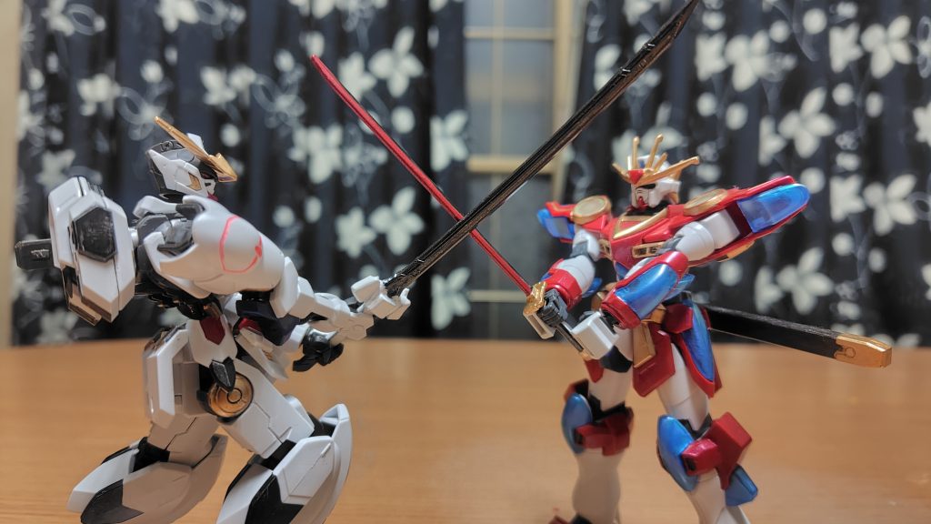 神バーニングガンダムと刃を交えた光景。