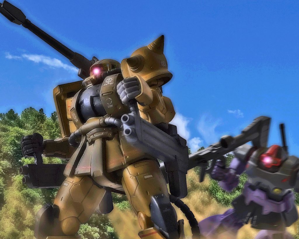 「少佐、我々もお供致しますっ!!」「ロレントか!?」「私も戦えますっ!」「バードンまでっ!?貴様ら先にキャリフォルニアベースに向かえと言っただろうっ!」ザクハーフキャノンとドムが森の影から飛び出す。「キャリフォルニアベースはもう既にドンパチ始まっていますよ」「何だとっ、別の主力がいたのか?」「我々が殲滅したMS部隊と陸戦艇は本隊ではなかったようです」ザクハーフキャノンに乗るロレントは機体を走らせる。「先に行った仲間達も既に交戦中かもしれません…」「…そうか、ニューヤークから何とかここまで来たが、どこも変わらないようだな」アーノルドはやや表情を曇らせたが、悲観している暇などない。「地球の企業の連中もガルマ大佐が戦死したと聞いて手の平返しやがって!俺達を連邦に売るなんてやっぱアースノイドは信用ならないですよ」ニューヤークも地球連邦軍のホワイトベースが来て以降、ガルマ・ザビを失いニューヤーク地区の指揮系統は大いに乱れた。部隊はバラけてしまい各々が小規模な局地戦を繰り返していたが、アーノルド達の部隊はキャリフォルニアベースを目指しここまで来た。このジヴァも撤退中のゴタゴタで1機分は何とか持ち出せたが、解体中の部品含め他は何処へ行ったか行方知れずである。「どのみち、この陸戦用MSは宇宙に持って行けませんし、親衛隊として少佐にだけ格好良い真似はさせられませんよ!」「……いいのか、お前ら?」「水くさい事は言わんでください、我々は親衛隊ですよ少佐殿!」「その親衛隊も総大将が亡くなり、設立前に白紙になったがな…。だがジオンの誇りまでは無くしていない…!!」アーノルドは自身を鼓舞し、スロットルレバーを握りしめる。「お前達の覚悟…、見届けさせてもらう!もはや命令などはしない…、各々が信じるものの為に戦えっ!!」「了解!!」