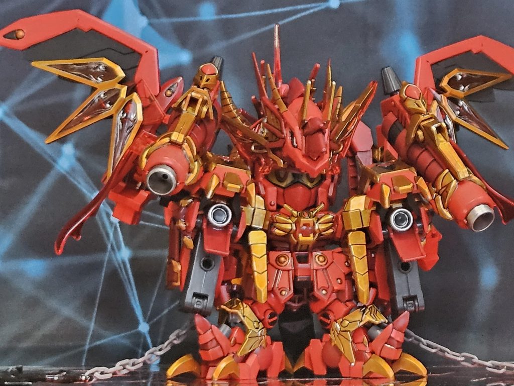 変形黙示録の魔王が地獄の業火を取り込んだ姿という設定。ストーリー展開向かった先には赤い竜が居た溶岩流が広範囲に広がり街に迫っていた。鬼神とサンダーボルトで溶岩流をせき止めに。残りのメンバー ゴッド 死期黄泉 ガンダムワルキューレ ヘルメリアで赤い竜を捕縛しに向かうガンダムワルキューレがエインフェリアを呼び出す。ガンダムギルガメッシュ捕縛の楔キャノンヘッド アメコミヒーロー的な超人(見た目はジム)ついに出番か!捕縛を試みるも強烈な咆哮を受け、拘束具は吹き飛ばされる。怯む事無く前に出るキャノンヘッドに対しメテオキャノンを叩き込む!━━が、砲弾を素手で叩き落とした。!?魔王よ見くびってくれるなよ!俺の主人公力は並ではない!!その瞬間キャノンヘッドはフッと消える。3倍速━━彗星拳━━そしてこれが赤き稲妻・雷電脚!!バチッズドォォォン!キャノンヘッドの攻撃で体制を崩すグレートレッド。ジム頭やるな!キャノンだ!ジムキャノン!それジムじゃん・・・。行くぞ皆ァ!!集え!我が同胞達よ!神々の黄昏(ラグナロク)オーバーロード!(時間誓約あり)北欧神 雷神トールギス、ヴァルキリーナイツ達、オーディン等多くの仲間が呼び出された 。ほうドラゴン退治とな。と仲間の誰かがボヤく。連携攻撃を試みるも決定打にはならず、仲間達はやむなく撤収。死期黄泉 知っているか?物には魂が宿るという事を!!三途の川を渡らせてくれるという死神百鬼夜行艦隊!!魑魅魍魎達が乗り込む無数の戦艦に続き戦闘機中隊を出現させる。主砲の雨により手数で制圧を試みる。━━━がダメージを受けている様子はなく、グレートレッドは飛翔し肩にあるメテオバズーカで1隻づつ確実に撃沈させていき。強力なブレスにより艦隊はほぼ壊滅させる。続いてヘルメリアが死霊部隊を無限召喚する。更に骨の巨神が姿を現す。グレートレッドに群がるも鎖付きの重剣を振り回して蹴散らし。ブレス攻撃で焼き尽くされる。背後から音もなく死期黄泉による秘伝・静寂なる死 サイレントキル(強制的に相手の肉体と魂を断ち切る技)がグレートレッドを捉える!手応えが…ない?肉体を持たないグレートレッドには効果がなかった。はい。さっさと離脱!ワルキューレが死期黄泉をフォロー。ビッグバンが一騎討ちしようと前へ出たところでグレートレッドに変化が現れる。変形し人型になった。黙示録の魔王だな?地獄から持ち出した地獄の業火(インフェルノ)を返してもらおうか?取り返してみろ!得意の接近戦に持っていこうとするビッグバン切りつけようとした所で肩装備から伸びてきたスネークバイトにより斬撃は止められへし折られる!ならば!悪しき者を祓え!カタルシスブライト(浄化する光)対悪魔&堕天使&邪神用の技で効果が期待出来た。む。これは━━?瞬時にスネークバイトを畳みシールド形態になり離脱するグレートレッド深追いは禁物か。次はドラゴンキラー持参します。ターゲティングは完了している。俺達も溶岩流食い止めに行くぞとサンダーボルト達に合流し後始末に加わる。 グレートレッドの目的 地上の何処かにある6ヶ所の封印を解く事。解く為の鍵が地獄の業火(インフェルノ)らしい。今回の件で一つ目の封印が解かれた。