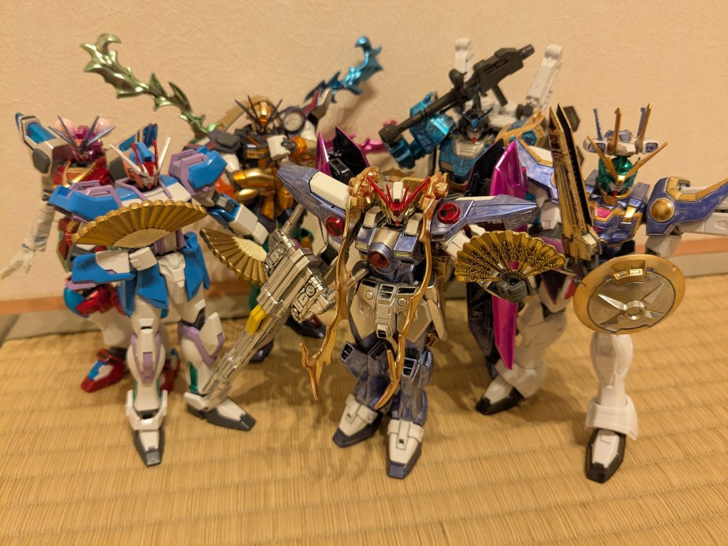 あずまあや先生のマンガ「SPELL」より、新しい幻想郷を作る会の皆さんの集合写真をイメージして1枚。今回の飯塚丸龍、摩陀羅隠岐奈の機体を作ったら、あと紫ができればメンバー揃う!と、思い、本作に至るという部分もあります(笑)過去作の四季映姫ヤマザナドゥ、西行寺幽々子、茨木華扇と、錚々たるメンバーを揃えられて満足の1枚です。