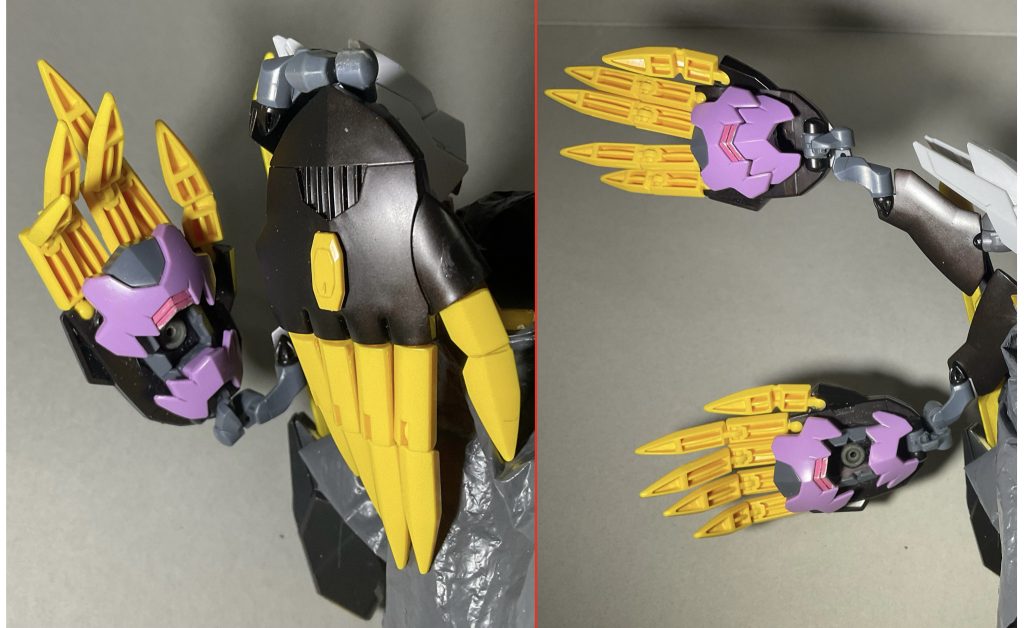 背面のサブアーム型特殊複合武装「N(ネメシス)ハンド」甲部分にはG(ゲシュマイディッヒ)・パンツァー機能とGNフィールド機能を混ぜた特殊武装「GN Gパンツァー」掌部分にはビーム砲(口内の目部分)やマガノイクタチ(口可動パーツ部分)などの複数の武装を搭載し多機能化そして指部分には内部エネルギーを結晶化させつつ胞子状ビッドを閉じ込めて射出し透明度の高いファングとして使用が可能です自分的にはこの武器に「ネメシス(義憤/ギフン)」という名前を使ったのも良かったと思ってます