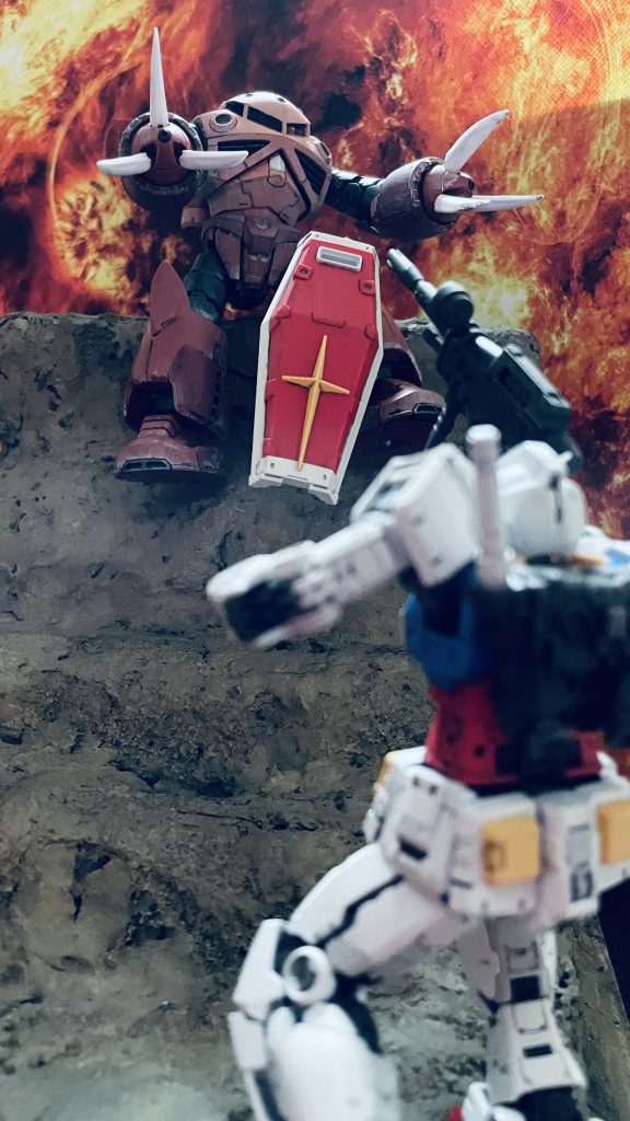 “さらに出来るようになったな、ガンダム!”ガンダムのシールドを挟んで撃ち合うアムロとシャアをイメージしています。